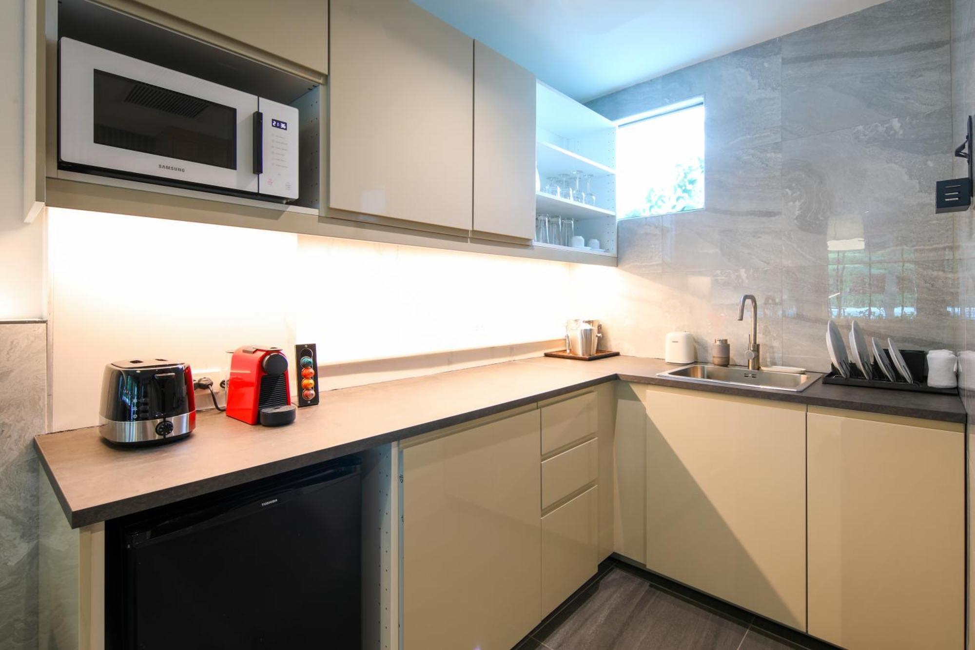 Craft Resort & Villas, Phuket Town Exterior foto A kitchen in a serviced apartment